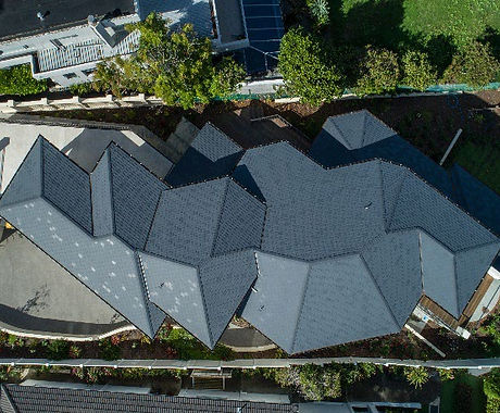 Complex multi-gable slate roof seen from above