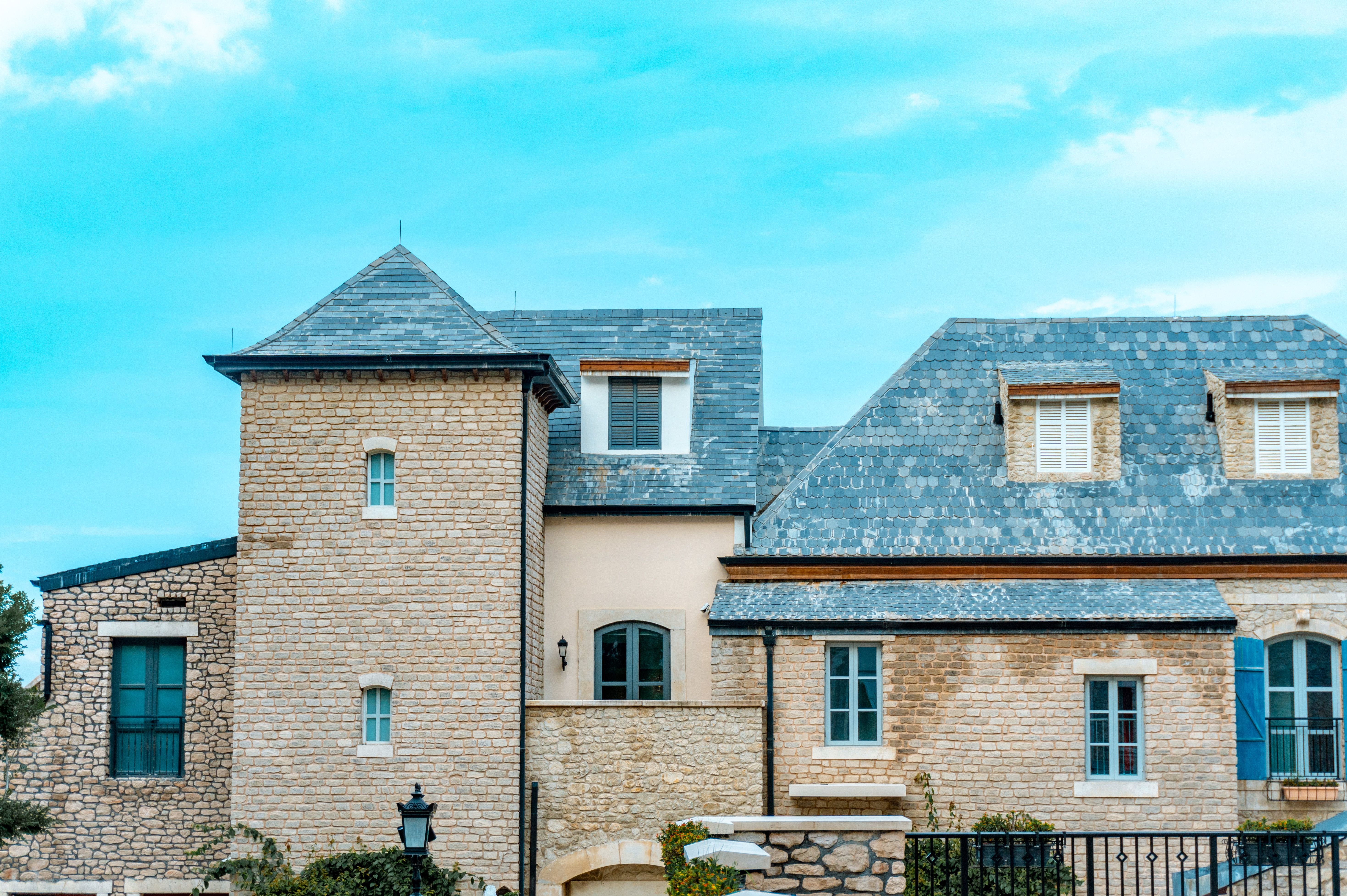 Stone home with a slate roof (sample image, replace with a real Shield job)